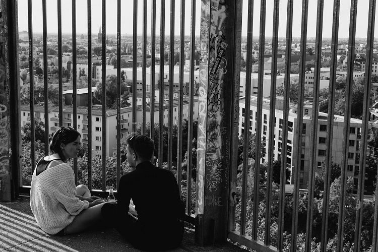 Young couple sitting and talking about their relationship issues